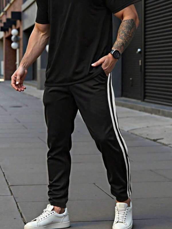 1 pieza Pantalones casuales y deportivos para hombres, pantalones de entrenamiento de corte holgado para primavera/verano, pantalones de entrenamiento de fitness, pantalones de playa transpirables y de ocio, pantalones cortos a rayas de moda para ir al trabajo