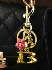 1 قطعة سلسلة مفاتيح أنيقة من سبيكة الزنك مطبوع عليها حرف وزهرة، سلسلة مفاتيح زهرية وحرفية للاستخدام على مدار العام، تميمة حقيبة مبتكرة بزهور الكرز والبرقوق، إكسسوارات سيارة وحقيبة مدرسية وأنماط غوثية وعيد الحب وعيد الميلاد، هدايا للمعلمين، حامل بطاقة الهوية