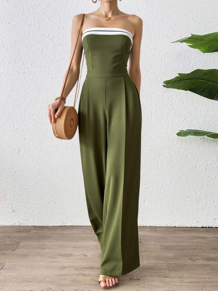 Mono largo de hombros descubiertos para mujer, de corte recto y con detalles de rayas decorativas en el escote. Confeccionado en tejido ligero con una caída espectacular, es perfecto para eventos de día o de noche y combina a la perfección con sandalias, tacones o accesorios elegantes. Esta versátil prenda estiliza la figura y ofrece un toque moderno y sofisticado, diseñado para quienes buscan comodidad y estilo. - Verde - Añade 3