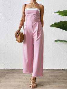 Mono largo de hombros descubiertos para mujer, de corte recto y con detalles de rayas decorativas en el escote. Confeccionado en tejido ligero con una caída espectacular, es perfecto para eventos de día o de noche y combina a la perfección con sandalias, tacones o accesorios elegantes. Esta versátil prenda estiliza la figura y ofrece un toque moderno y sofisticado, diseñado para quienes buscan comodidad y estilo. - Rosa - Ver 3
