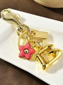 1 قطعة سلسلة مفاتيح أنيقة من سبيكة الزنك مطبوع عليها حرف وزهرة، سلسلة مفاتيح زهرية وحرفية للاستخدام على مدار العام، تميمة حقيبة مبتكرة بزهور الكرز والبرقوق، إكسسوارات سيارة وحقيبة مدرسية وأنماط غوثية وعيد الحب وعيد الميلاد، هدايا للمعلمين، حامل بطاقة الهوية