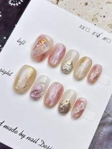 10片中号椭圆形假指甲，闪亮透明多色融合，优雅金色箔片和闪亮元素设计，光泽亮丽，100%纯手工制作，按压式亚克力指甲，可重复使用。美甲用品套装包含1片果冻胶、1根胶棒和1把指甲锉，适合女性日常或派对佩戴。 - 彩色 - 查看 13