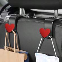 2 piezas Ganchos creativos con forma de corazón para reposacabezas de coche, organizadores de almacenamiento para el coche para colgar bolsas, carteras, bolsas de la compra, paraguas