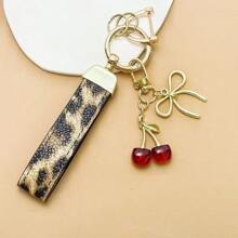 TTOBS 1pc Exquisitely Crafted Leopard Print Leather Car Key Chain With Adorable Cherry Pendant - , Fashionable And Multi-Functional Backpack Keychain - The Perfect Accessory For Backpacks. The Perfect Valentine's Day Gift, Also An Ideal Gift For Your Beloved Girlfriend.