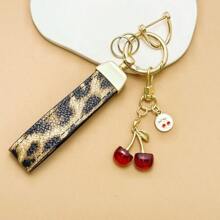 TTOBS 1pc Exquisitely Crafted Leopard Print Leather Car Key Chain With Adorable Cherry Pendant - , Fashionable And Multi-Functional Backpack Keychain - The Perfect Accessory For Backpacks. The Perfect Valentine's Day Gift, Also An Ideal Gift For Your Beloved Girlfriend.