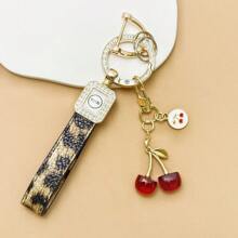 TTOBS 1pc Exquisitely Crafted Leopard Print Leather Car Key Chain With Adorable Cherry Pendant - , Fashionable And Multi-Functional Backpack Keychain - The Perfect Accessory For Backpacks. The Perfect Valentine's Day Gift, Also An Ideal Gift For Your Beloved Girlfriend.