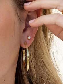 Our Simple Stud Earrings Are A Staple Every Gold Or Sterling Silver Jewelry Collection Needs. With A Cubic Zirconia Stone Front And Center, These Simple Stud Earrings Pair Well With All Of Your Other Uncommon James Ea