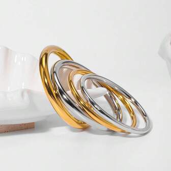 1個金屬手環,不銹鋼製成,18k金鍍層,簡約設計,為潮流風格添加涼感