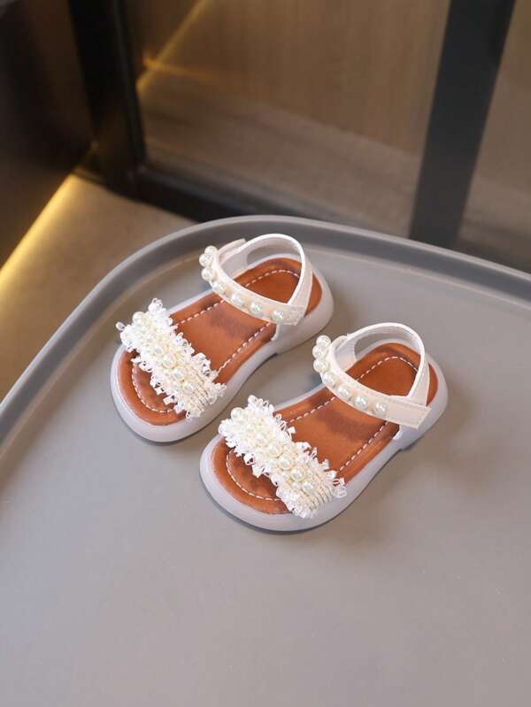 1 paire de sandales classiques pour enfants avec décor de nœud et tour, design plat en PU à lacets, mignonnes sandales bébé convenant aux filles au printemps, été, automne, hiver