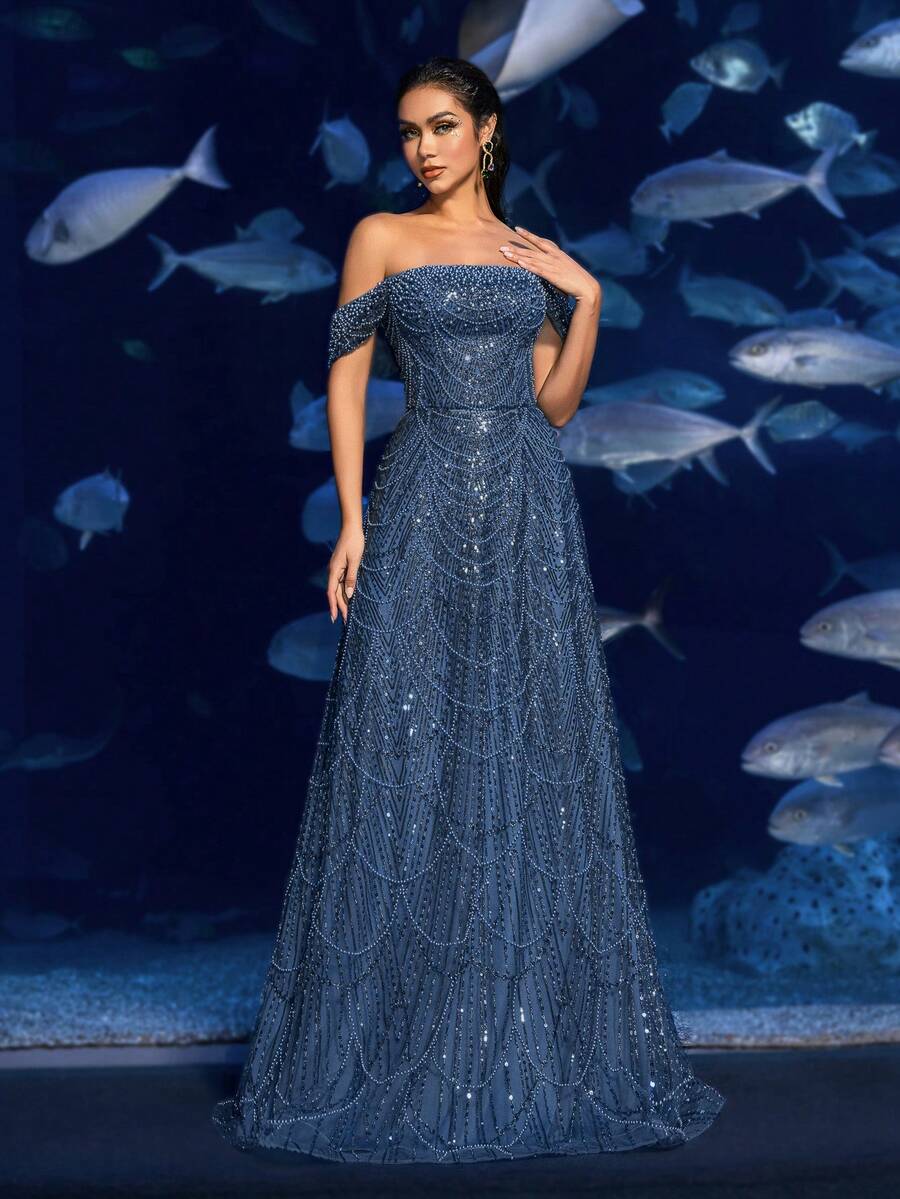 Faeriesty Đầm dạ hội đính cườm và sequin trễ vai thanh lịch – Đuôi váy dài chấm đất kiểu đuôi cá, toàn thân được trang trí lấp lánh, thích hợp cho các buổi dạ tiệc thảm đỏ, đám cưới sang trọng, tiệc tối trang trọng và các sự kiện thời trang lấy cảm hứng từ thế giới dưới nước. Mùa xuân này, bạn có thể tham dự các bữa tiệc.