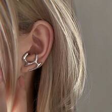 1 paire de boucles d'oreilles asymétriques à la mode et ajourées