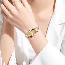 1 pieza Reloj de pulsera de cuarzo de estilo casual y elegante para mujer con esfera decorada con rhinestones y correa de acero, sin estuche de reloj incluido