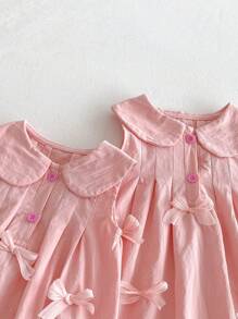 Barboteuse pour bébé fille avec décoration de nœud rose, été
