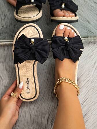 Sandalias de mujer 2025 Primavera/Verano Nueva moda elegante clásica para exterior antideslizante resistente al desgaste con lazo, sandalias de dedo abiertas, chanclas casuales para vacaciones en la playa