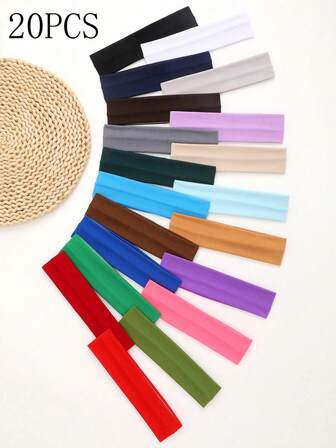 20条男女通用头带，长发短发皆宜。简约高弹力头带。柔软面料头带，适合运动、瑜伽和健身。这些发饰适合瑜伽、跑步、健身等日常活动。纯色、休闲街头风格的运动头带，采用涤纶材质。四季皆宜的头巾式吸汗带