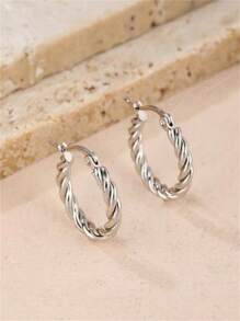 A Pair Of Fashionable And Versatile Round Twisted Stainless Steel Earrings Suitable For Ladies To Wear Daily.