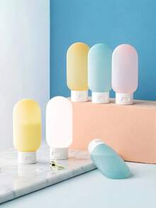 مجموعة من 3/4 زجاجات سفر من السيليكون والبلاستيك، سعة 2.03 أونصة، قابلة لإعادة الملء، منع التسرب، حاويات مستحضرات تجميلية بلا رائحة للكريمات والعناية بالبشرة والاستحمام، طقم أدوات تجميل صغيرة محمولة - متعدد الألوان - مشاهدة 2