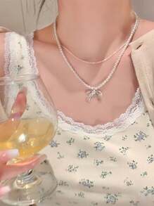 2 pièces Collier de luxe à double couche en cristal avec nœud papillon et perle, collier délicat pour la clavicule, accessoire pour femmes