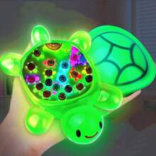 Jucărie decorativă luminoasă colorată în formă de broască țestoasă gigantică (trebuie să absoarbă lumina ultravioletă) care poate fi folosită ca ornament pentru casă - poate fi plasată pe birouri, pervazuri etc. și poate fi folosită și pentru decorarea petrecerilor, creând o atmosferă veselă. Este un cadou excelent pentru pasionații de broaște țestoase și cadouri de ziua de naștere (carapacele broaștelor țestoase nu sunt strălucitoare).