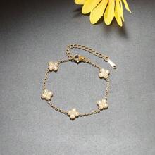 Conjunto de joyas de acero inoxidable 316L con flores doradas incrustadas de piedras de circonita, incluyendo collar, pendientes, pulsera y anillo, un conjunto de joyas para niñas que no se desvanece