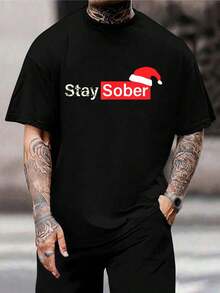 Camiseta de Navidad con gorro de Papá Noel y mensaje 'Mantente sobrio' - Divertido regalo de recuperación para fiestas, camiseta gráfica con humor negro para hombres y mujeres, camiseta informal de algodón, cuello redondo, manga corta - Negro - Ver 1