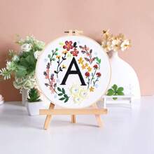 1pc 26 Designs Floral Embroidery Kit With English Letters, Luxury Starter Set For Beginners, Includes Fabric, Hoop, Threads, Needles, Instructions, Great For Cross Stitch, Artistic Craft Gift For Friends And Family, Wedding Decor. Each Kit Contains 1pc Printed , 1 Set Of Embroidery Threads, 1 Bamboo Embroidery Hoop, 1 Pattern Chart, 2pcs Embroidery Needles.