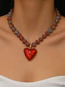 1件优雅时尚个性化金色爱心吊坠项链，橙红色树脂3D爱心吊坠，法式滴油金链，不对称串珠款式，高品质女士项链，适合日常佩戴、度假、派对，可搭配性感服饰。请注意，每个树脂吊坠底部都有注塑成型的浇口。 - 彩色 - 查看 2