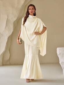 زي فستان عبارة عن قطعتين للمرأة سوليد كول حيث يرتكب من ملابس علوية بأكمام على شكل أجنحة الخفافيش وتنورة قصيرة بذيل السمكة - لون مشمشي - مشاهدة 3