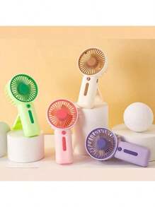 1 pezzo Mini ventilatore portatile alimentato a batterie 2xAAA (batterie non incluse) per il ritorno a scuola