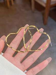 1 paire de boucles d'oreilles créoles à couches plaquées or rose sculptées