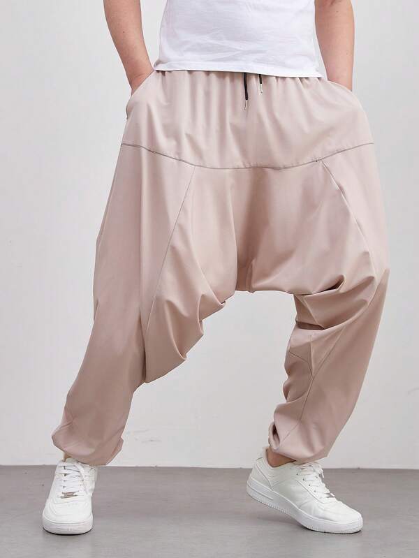 بنطلون كاجوال رجالي فضفاض ذو لون أحادي وتصميم هارم، بنطال اليوغا اليومي، باللون الخاكي العصري مع جيوب، خصر به رباط، مناسب للشاطئ والأعياد