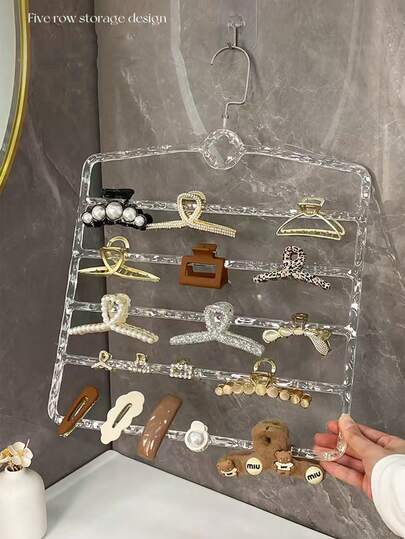 1个极简透明多层发夹收纳架，壁挂式发饰晾干架，带透明隔层的发夹和发带收纳架，节省空间，适用于卧室和梳妆台，方便取用，整齐收纳，经久耐用，轻巧透明，可低调展示；固定发饰，减少梳妆台或墙面杂乱；是美妆爱好者、手工爱好者和小户型居住者的理想之选；以现代简约美学提升家居装饰格调。