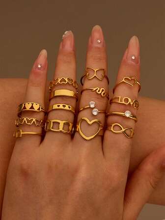 Set de 15 piezas de anillos de acero inoxidable dorado con formas de mariposa, diamante, serpiente y corazón