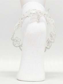 زوج من جوارب البنات مزينة بالكشكشة والفصوص الزهرية ذات طرف وردي اللون الذهبي والفضي