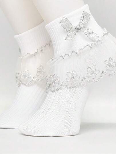 زوج من جوارب البنات مزينة بالكشكشة والفصوص الزهرية ذات طرف وردي اللون الذهبي والفضي