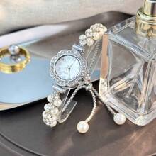 1 pièce Montre à quartz mode femme avec chaîne ajustable rétractable à double perle, boîtier en alliage, cadran avec chiffres arabes, design élégant pour femme et étudiante