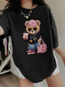 Camiseta de manga corta con cuello redondo y estampado casual, adecuada para niñas y niños. Los patrones de bolso de mano y oso de peluche inspiran la imaginación y la autoexpresión. Ropa de verano para estudiantes y niños. - Negro - Ver 4