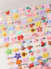 Paquete de 50 pinzas de pelo para niñas con diseños variados de frutas, animales, flores, arcoíris, estrellas y coronas. Accesorios de moda versátiles, aptos para uso diario.