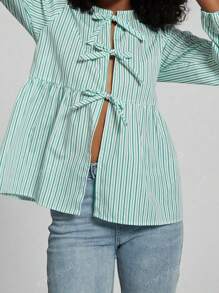 Camisa de mujer de moda casual con cuello redondo, lazo, bajo con volantes y mangas abullonadas en colores lisos