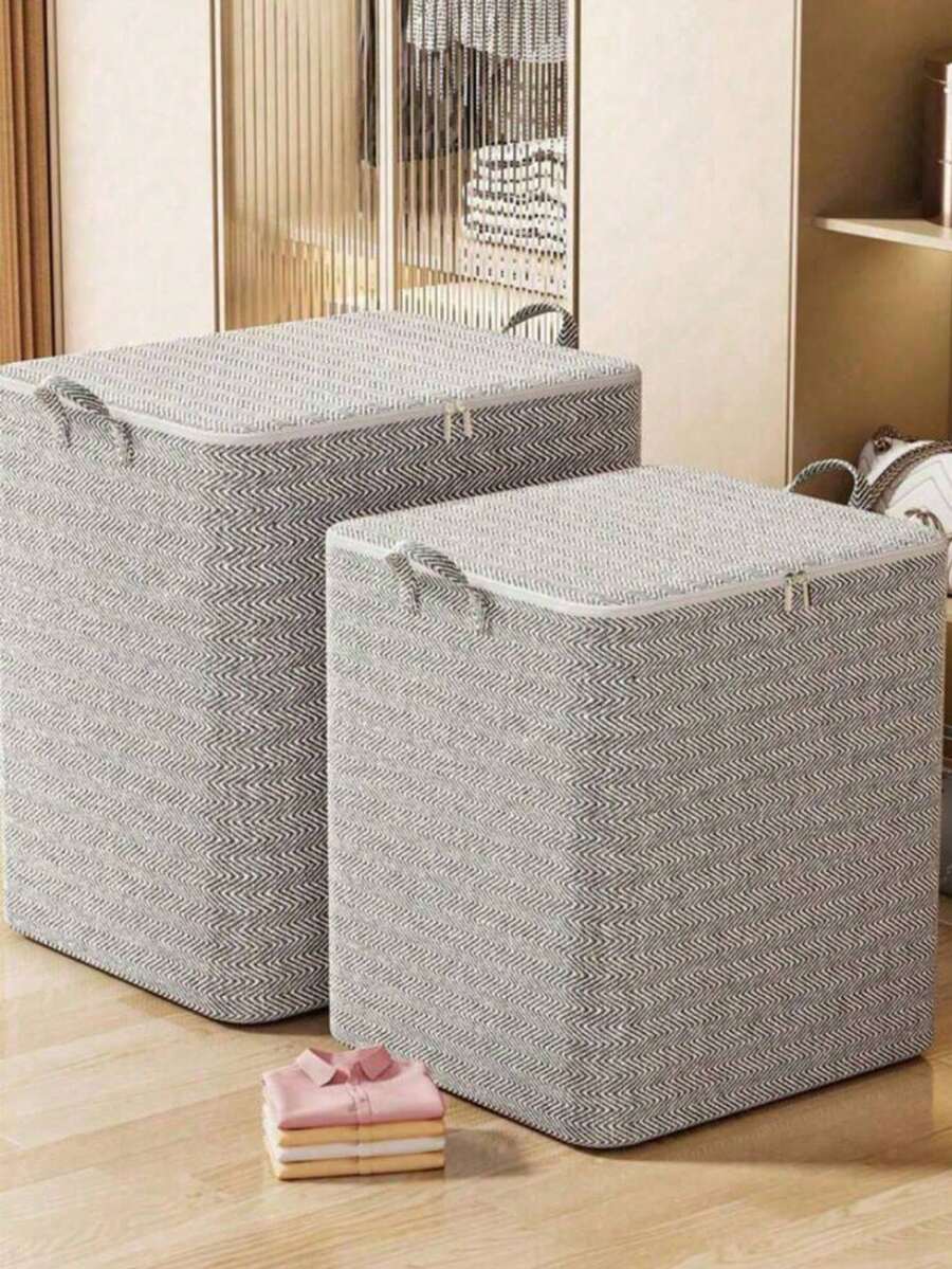 Una caja de almacenamiento plegable con asa, adecuada para organizar cosméticos. Cuenta con una gran capacidad hecha de tela no tejida y poliéster, diseñada con un elegante patrón gris a rayas, perfecta para la organización del armario. - Multicolor - Ver 1