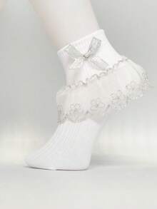 زوج من جوارب البنات مزينة بالكشكشة والفصوص الزهرية ذات طرف وردي اللون الذهبي والفضي