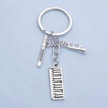 1 件男女通用音乐爱好者钥匙扣鼓套装吉他音符小号钢琴麦克风乐器 DIY 配件音乐节礼品袋饰品 - 銀色 - 查看 13
