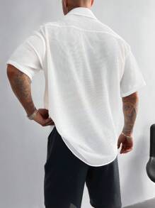 Ropa casual de vacaciones para hombre, perfecta para salidas y uso diario, con una camisa de manga corta suelta de unicolor clásico con cierre de botones.