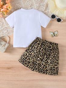 Set de 2 piezas de ropa informal de verano para niñas, camiseta de cuello redondo de manga corta con estampado de letras y leopardo, y falda asimétrica con decoración de lazo de estampado de leopardo, apropiada para uso al aire libre, en la escuela, fiestas y uso diario