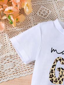 Set de 2 piezas de ropa informal de verano para niñas, camiseta de cuello redondo de manga corta con estampado de letras y leopardo, y falda asimétrica con decoración de lazo de estampado de leopardo, apropiada para uso al aire libre, en la escuela, fiestas y uso diario