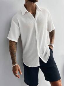 Ropa casual de vacaciones para hombre, perfecta para salidas y uso diario, con una camisa de manga corta suelta de unicolor clásico con cierre de botones.