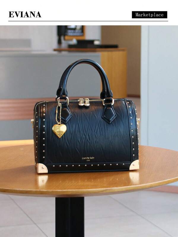 Nuevo bolso de mujer de alta gama y moda 2025, bolso de bolos de gran capacidad y acolchado, bolso de hombro tipo caja con remaches vintage, versátil bolso satchel de estilo callejero personalizado con asa superior, bolso de estructura de caja