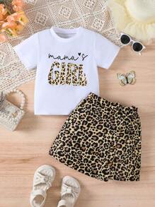 Set de 2 piezas de ropa informal de verano para niñas, camiseta de cuello redondo de manga corta con estampado de letras y leopardo, y falda asimétrica con decoración de lazo de estampado de leopardo, apropiada para uso al aire libre, en la escuela, fiestas y uso diario