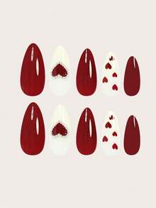 24片中号杏仁形极简3D爱心樱桃红假指甲，为您的美甲增添浪漫气息。这款全覆盖假指甲套装包含1张粘性贴纸和1个迷你指甲锉，适合情人节、母亲节、派对、约会和日常佩戴。指甲胶水随机发货。