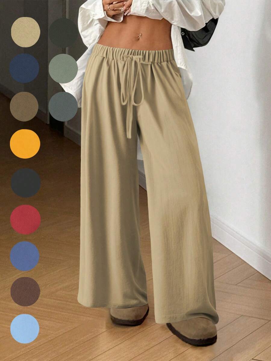 飘逸阔腿裤：轻盈梭织面料搭配弹性抽绳腰带，修身百搭，适合通勤、购物、居家休闲等各种场合。2026春秋新款休闲女裤，适合约会、学生和日常出行。百搭款式，休闲百搭，可轻松驾驭海滩等各种场合。抽绳腰带设计，休闲舒适，适合外出和居家穿着。 - 卡其色 - 查看 1